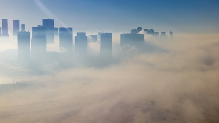 Skylines under the thick fog at the street timelapse of Abu Dhabi at morning
