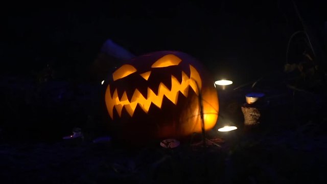 Halloween pumpkin with burning candles