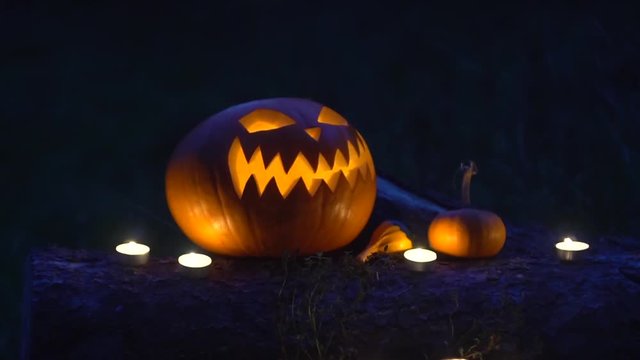 Halloween pumpkin with burning candles