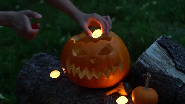 Halloween pumpkin with burning candles