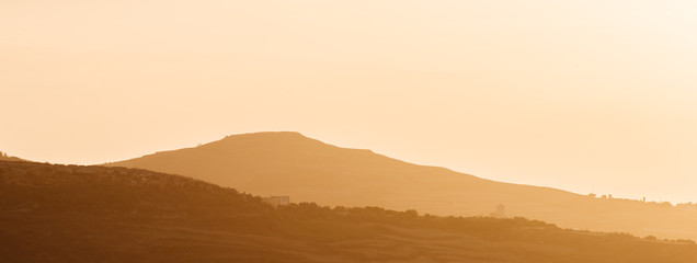 Golden sunset, lansacpe showing distant hills