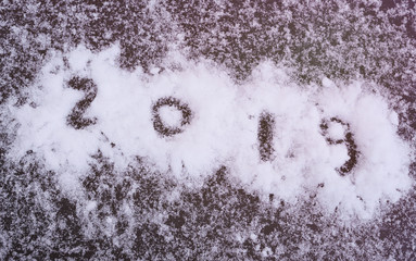  inscription 2019 on the snow close-up. New Year two thousand and nineteen. Designer workpiece, element.