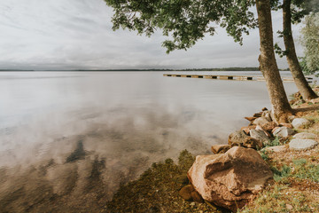 A boat pier on a still lake.