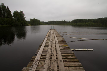 A boat pier on a still lake.