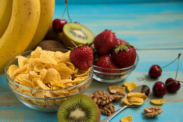 Tasty cornflakes witt walnut in glass bowl