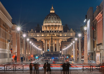 Rome, St. Peter's Basilica at night, with blurred tourists