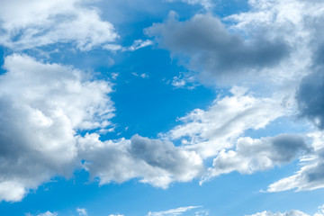 Fototapeta premium Endless blue sky and grey and white rain clouds