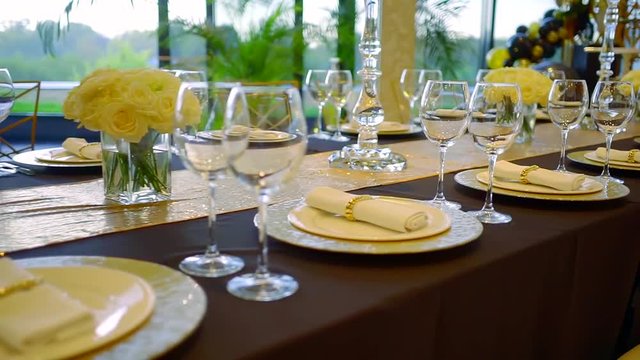Wedding catering in a restaurant, table set for fancy event.