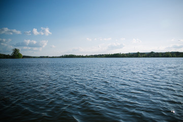 Spring evening sunny landscape near the river