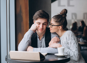 Guy and girl at a meeting in a cafe