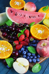 Fresh fruits on wooden background, Healthy diet.