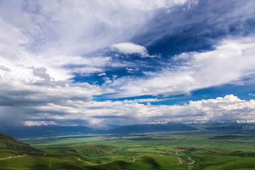 Fototapeta na wymiar Mountain landscape. High mountain green valley. Suusamyr Valley. Kyrgyzstan