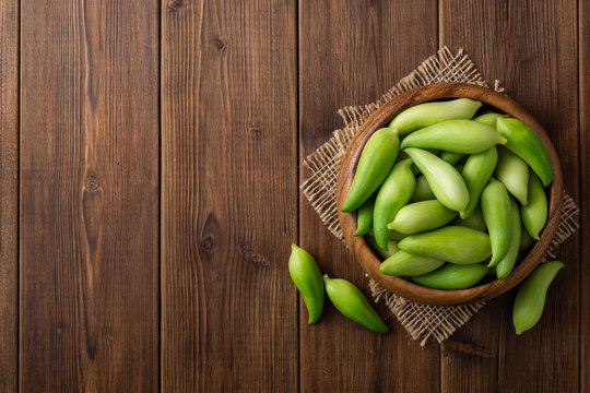 Cyclanthera pedata or kaywa or caigua or achuqcha - Latin American vegetable in bowl on wooden background. Selective focus.