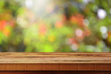 Wooden table and blurred bokeh background.