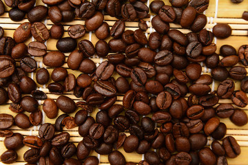 Coffee beans on a bamboo mat