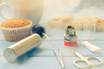 Still life with e-ciggarete and coffe on the wooden background
