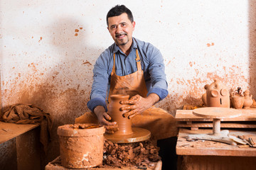 Mature man making pot