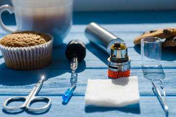 Still life with e-ciggarete and coffe on the wooden background