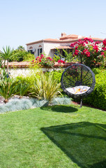 luxury hotel with a garden and swimming pool