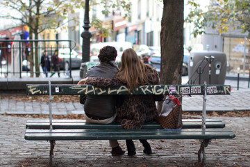 Couple siiting on the bench in Montmartre hill, Paris