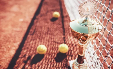 Zelfklevend Fotobehang Tennis balls and cup on the tennis court. Sport, recreation concept © bobex73