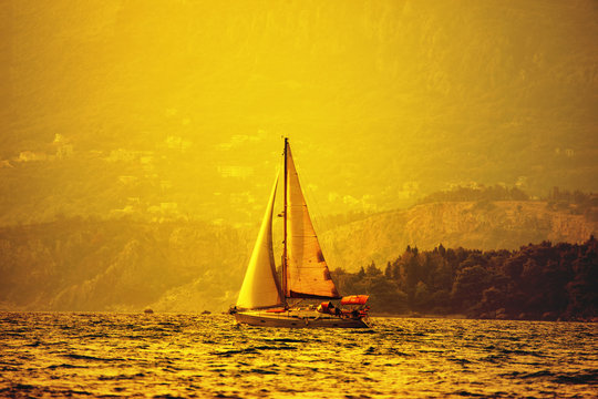 image in retro style with yacht in the sunlight