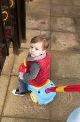 Fototapeta premium baby with a toy car in a park