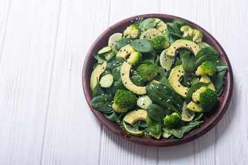 Green baby spinach salad with avocado