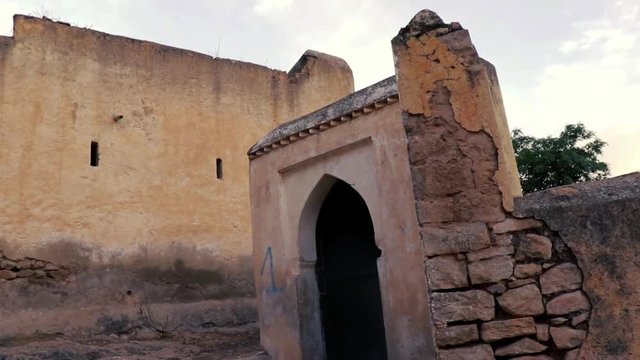 Old ancient ruins of abandoned buildings in Algeria, Tlemcen, tilt shot