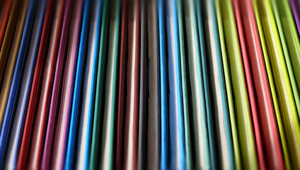 Row of little books with colorful covers 