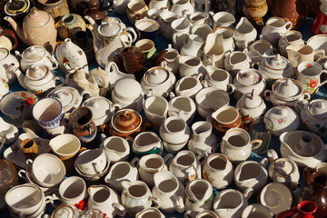 Flea market. Sale of old things. Sale of old porcelain ware in the market.