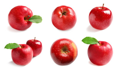 Set with delicious red apples on white background