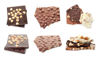 Set with different kinds of delicious chocolate and nuts on white background