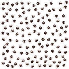 Huellas de perro marrones con pequeñas salpicaduras de barro sobre fondo blanco.