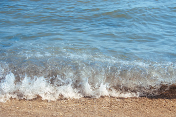 Background sea, ocean, surf waves on the beach