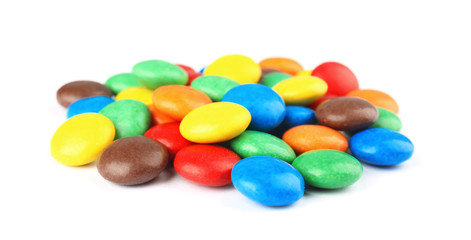 Pile of colorful candies on white background