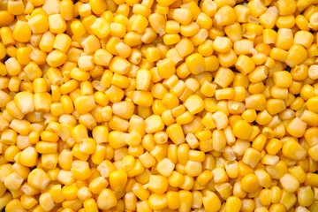 Deurstickers Ripe corn kernels as background, top view © New Africa