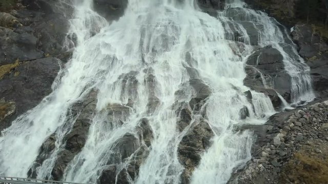Close Up View of the Famous Furebergfossen Waterfall in Norway, Sliding Drone Shot