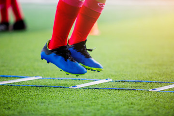 Young player exercises on ladder drills.