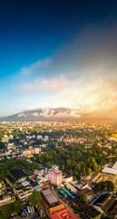 Aerial Panorama View of Chiang Mai City with sunrise and clouds, Thailand.