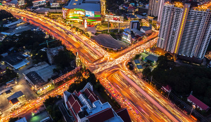 Fototapeta na wymiar CHIANG MAI, THAILAND- AUGUST 7, 2018 : City x cross traffic express way intersection road with light of vehicle aerial view, drone view.