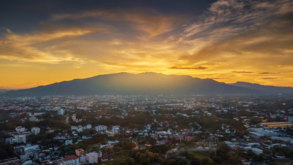 Fototapeta na wymiar CHIANG MAI, THAILAND- AUGUST 7, 2018 : Aerial Panorama View of Chiang Mai City with sunset and twilight sky.