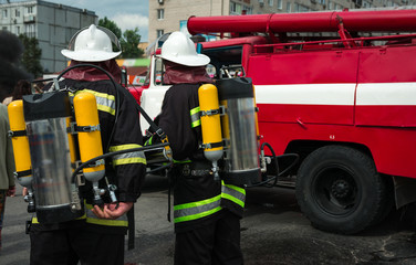 firefighter extinguishes the fire with smoke.