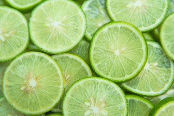 Fototapeta na wymiar Citrus fruit of lime slices background