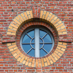 Fototapeta premium WIndow on brick wall