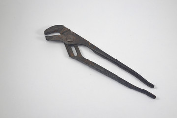 Old used pliers on white background