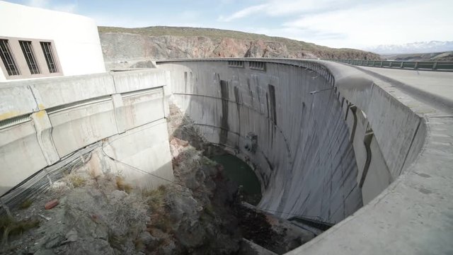 Detail of semi circular concrete support of Agua de Toro Dam. Hand held camera looking downwards looking the huge precipice. San Rafael, Argentina