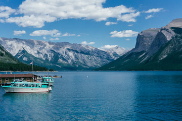 blue lake and boats in the mountains