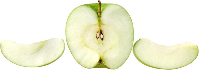 Green apple cut in half next to apple wedges