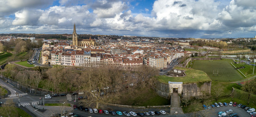 Aerial panorama view of Bayonne France with the medieval cathedral, colorful traditional French houses stormy cloudy sky in the background